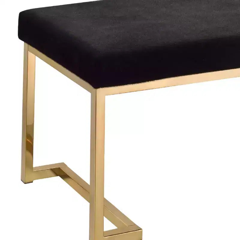 Banc rembourré en tissu noir et or