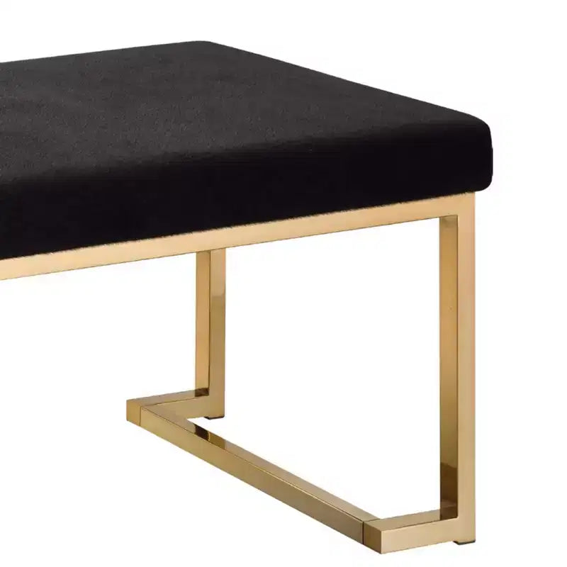 Banc rembourré en tissu noir et or